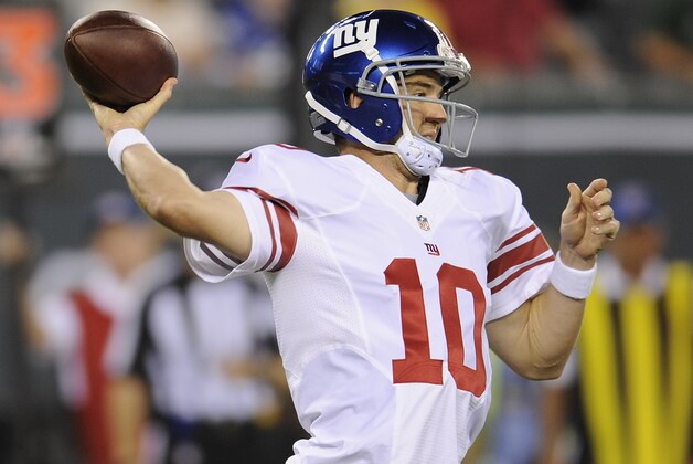 New York Giants quarterback Eli Manning (10) throws against the New York Jets in the first quarter of a preseason NFL football game, Friday, Aug. 22, 2014, in East Rutherford, N.J. (AP Photo/Bill Kostroun)