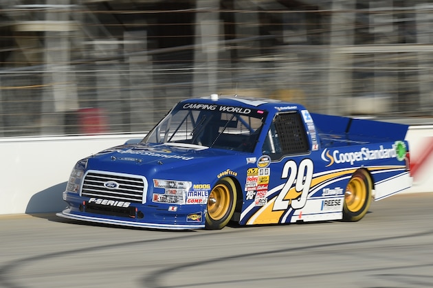 Ryan Blaney (29) races to second place in the NASCAR Truck Series auto race Friday, May 30, 2014, at Dover International Speedway in Dover, Del. (AP Photo/Molly Riley)