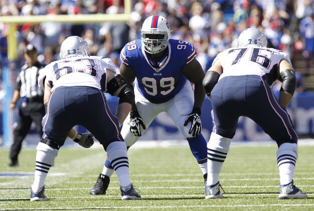 Sep 8, 2013; Orchard Park, NY, USA; Buffalo Bills defensive tackle Marcell Dareus (99) lines up across from New England Patriots guard Dan Connolly (63) and tackle Sebastian Vollmer (76) during the first half at Ralph Wilson Stadium. Patriots beat the Bills 23-21. Mandatory Credit: Kevin Hoffman-USA TODAY Sports