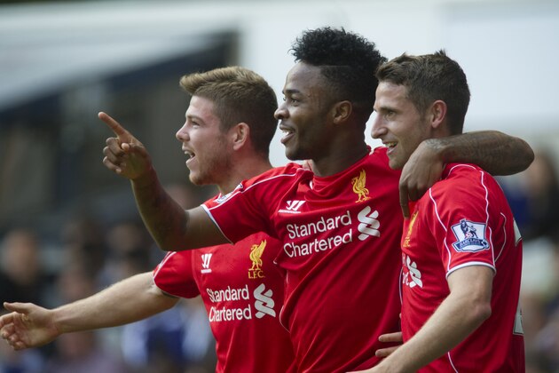 Liverpool's Raheem Sterling, center, celebrates with teammates Joe Allen, right, and Alberto Moreno after scoring against Tottenham Hotspur, during their English Premier League soccer match at White Hart Lane, London, Sunday, Aug. 31, 2014 (AP Photo/Bogdan Maran)