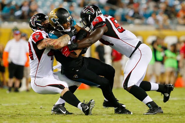 JACKSONVILLE, FL - AUGUST 28:  Mike Brown #12 of the Jacksonville Jaguars is tackled by  Pat Angerer #44 of the Atlanta Falcons and  Jonathan Massaquoi #94 during the preseason NFL game at EverBank Field on August 28, 2014 in Jacksonville, Florida.  (Photo by Sam Greenwood/Getty Images)