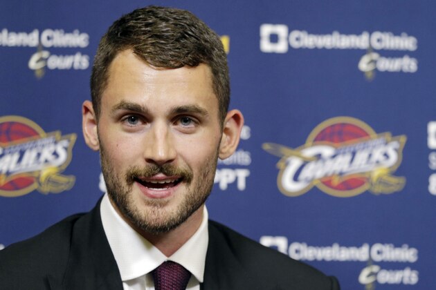 Cleveland Cavaliers' Kevin Love answers questions during his introductory news conference at the NBA basketball team's practice facility in Independence, Ohio  Tuesday, Aug. 26, 2014. Love was acquired from the Minnesota Timberwolves in a three-team trade that was finalized over the weekend. (AP Photo/Mark Duncan)