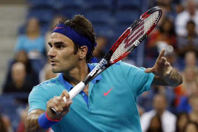 Roger Federer, of Switzerland, returns to Marcel Granollers, of Spain, during the third round of the 2014 U.S. Open tennis tournament, Sunday, Aug. 31, 2014, in New York. (AP Photo/Elise Amendola)