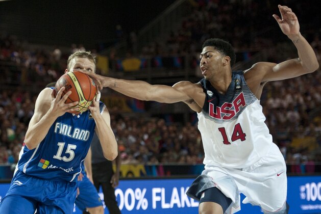 United States's Anthony Davis, right,  duels for the ball beside Finland's Antero Lehto, during the Group C Basketball World Cup match between United States and Finland,  in Bilbao northern Spain, Saturday, Aug. 30, 2014. The 2014 Basketball World Cup competition will take place in various cities in Spain from Aug. 30 through to Sept. 14. (AP Photo/Alvaro Barrientos)