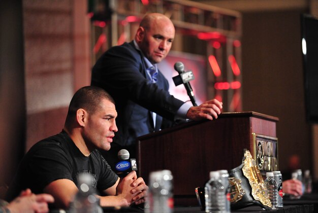 Dec 29, 2012; Las Vegas, NV, USA; Cain Velasquez speaks during post fight press conference as UFC president Dana White listens at UFC 155 at the MGM Grand Garden Arena. Mandatory Credit: Gary A. Vasquez-USA TODAY Sports