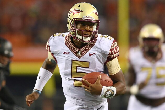 ARLINGTON, TX - AUGUST 30:  Jameis Winston #5 of the Florida State Seminoles runs for a touchdown against the Oklahoma State Cowboys in the second half of the Advocare Cowboys Classic at AT&T Stadium on August 30, 2014 in Arlington, Texas.  (Photo by Ronald Martinez/Getty Images)