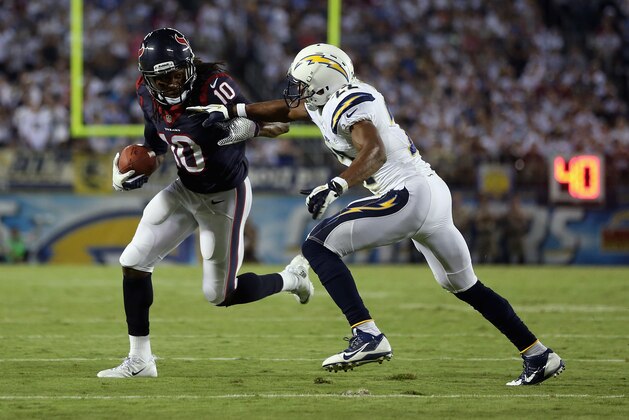 SAN DIEGO, CA - SEPTEMBER 09: Wide receiver DeAndre Hopkins #10 of the Houston Texans is pursued by cornerback Derek Cox #22 of the San Diego Chargers in the third quarter at Qualcomm Stadium on September 9, 2013 in San Diego, California. The Texans defeated the Chargers 31-28.  (Photo by Jeff Gross/Getty Images)
