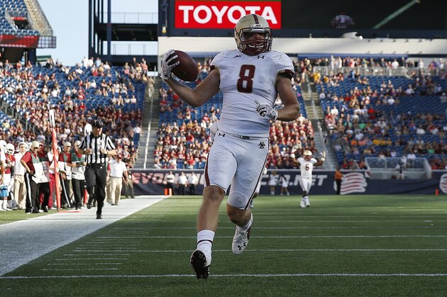 Boston College wide receiver Josh Bordner (8) scores on a touchdown pass during the fourth quarter of an NCAA college football game against Massachusetts in Foxborough, Mass., Saturday, Aug. 30, 2014. Boston College won 30-7. (AP Photo/Michael Dwyer)
