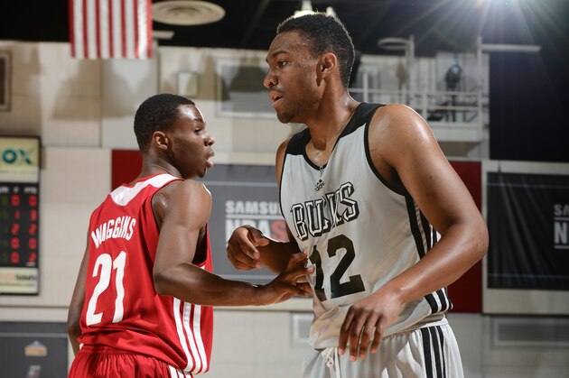 LAS VEGAS, NV - JULY 11: Andrew Wiggins #21 of the Cleveland Cavaliers defends against Jabari Parker #12 of the Milwaukee Bucks at the Samsung NBA Summer League 2014 on July 11, 2014 at the Cox Pavilion in Las Vegas, Nevada. NOTE TO USER: User expressly acknowledges and agrees that, by downloading and or using this photograph, User is consenting to the terms and conditions of the Getty Images License Agreement. Mandatory Copyright Notice: Copyright 2014 NBAE (Photo by Garrett Ellwood/NBAE via Getty Images)