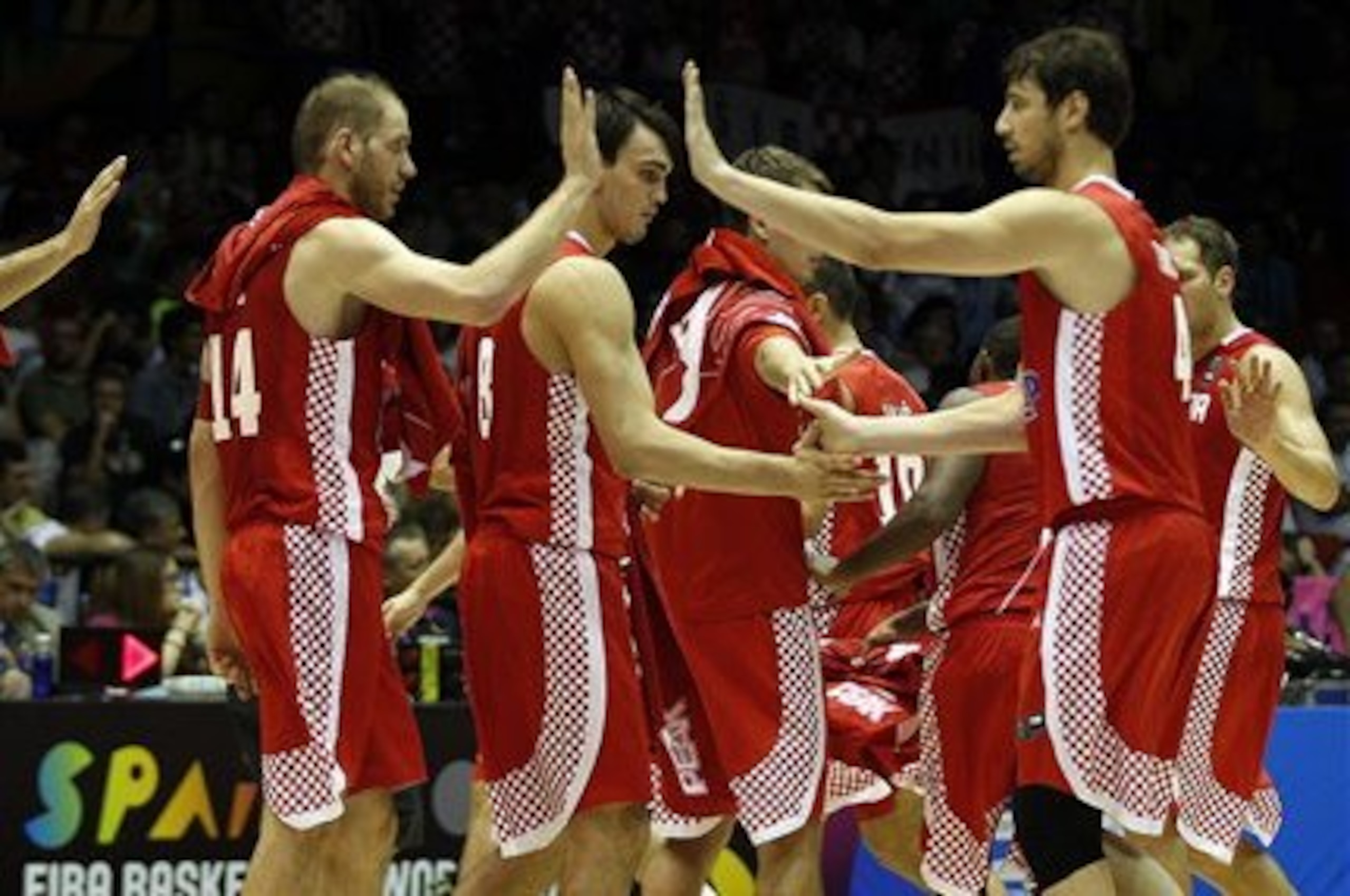 Croatia's players celebrate after winning the match against Argentina during the Group B Basketball World Cup match between Argentina and Croatia in Seville, Spain, Sunday, Aug. 31, 2014. The 2014 Basketball World Cup competition will take place in various cities in Spain from Aug. 30 through to Sept. 14. (AP Photo/Miguel Angel Morenatti)