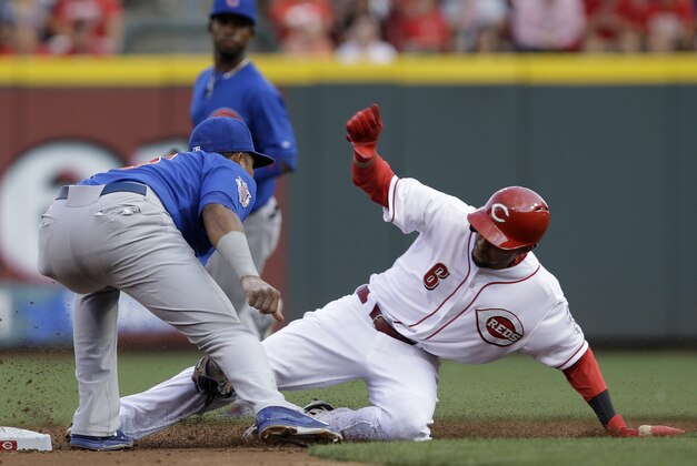 Cincinnati Reds' Billy Hamilton (6) is tagged out by Chicago Cubs shortstop Starlin Castro trying to steal second base in the third inning of a baseball game, Wednesday, July 9, 2014, in Cincinnati. (AP Photo/Al Behrman)