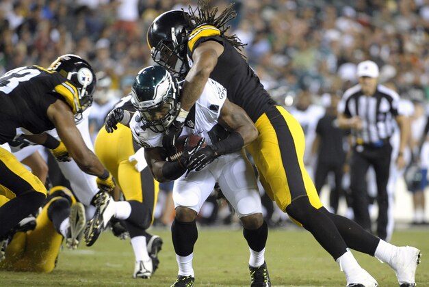 Aug 21, 2014; Philadelphia, PA, USA; Philadelphia Eagles running back Henry Josey (34) is stopped by Pittsburgh Steelers outside linebacker Jarvis Jones (95) at Lincoln Financial Field. The Eagles defeated the Steelers, 31-21.  Mandatory Credit: Eric Hartline-USA TODAY Sports
