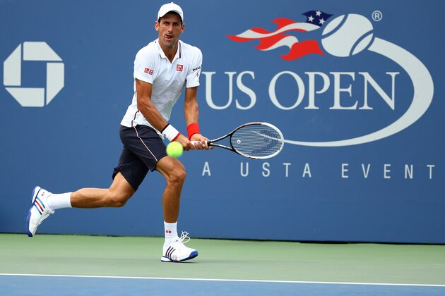 NEW YORK, NY - SEPTEMBER 01:  Novak Djokovic of Serbia returns a shot to Philipp Kohlschreiber of Germany during their men's singles fourth round match on Day Eight of the 2014 US Open at the USTA Billie Jean King National Tennis Center on September 1, 2014 in the Flushing neighborhood of the Queens borough of New York City.  (Photo by Al Bello/Getty Images)