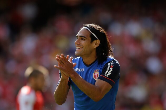 AS Monaco's Radamel Falcao applauds a teammate during the Emirates Cup soccer match between Arsenal and AS Monaco at Arsenal's Emirates Stadium, London, Sunday, Aug. 3, 2014.  (AP Photo/Matt Dunham)