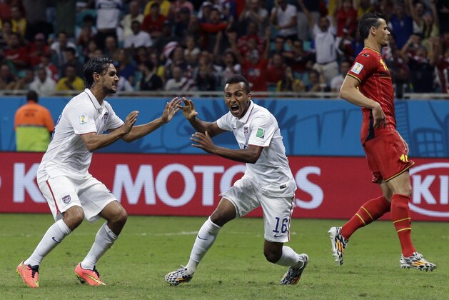 United States' Julian Green, center, celebrates after scoring his side's first goal during the World Cup round of 16 soccer match between Belgium and the USA at the Arena Fonte Nova in Salvador, Brazil, Tuesday, July 1, 2014. (AP Photo/Matt Dunham)