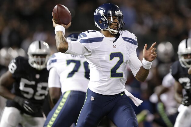 Seattle Seahawks quarterback Terrelle Pryor (2) passes against the Oakland Raiders during the second quarter of an NFL preseason football game in Oakland, Calif., Thursday, Aug. 28, 2014. (AP Photo/Marcio Jose Sanchez)