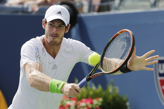 Andy Murray, of the United Kingdom, returns a shot against Jo-Wilfried Tsonga, of France, during the fourth round of the 2014 U.S. Open tennis tournament, Monday, Sept. 1, 2014, in New York. (AP Photo/Charles Krupa)
