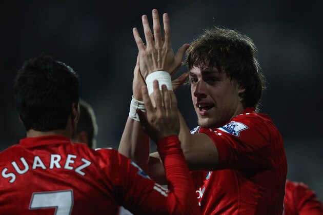 LONDON, ENGLAND - MARCH 21:  Sebastian Coates of Liverpool celebrates scoring the first goal during the Barclays Premier League match between Queens Park Rangers and Liverpool at Loftus Road on March 21, 2012 in London, England.  (Photo by Ian Walton/Getty Images)