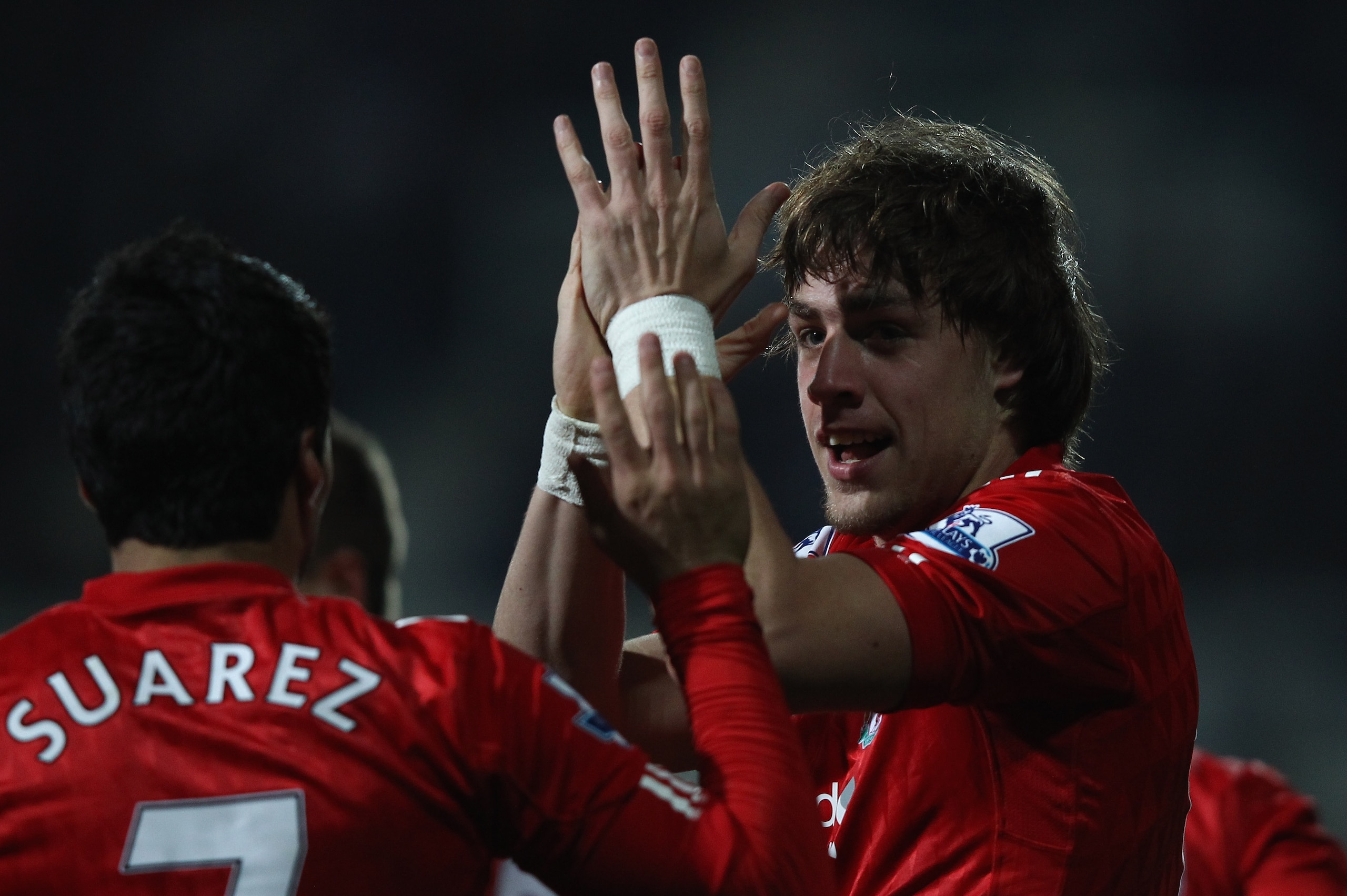 LONDON, ENGLAND - MARCH 21:  Sebastian Coates of Liverpool celebrates scoring the first goal during the Barclays Premier League match between Queens Park Rangers and Liverpool at Loftus Road on March 21, 2012 in London, England.  (Photo by Ian Walton/Getty Images)