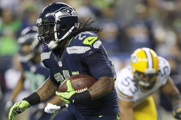 Seattle Seahawks' Marshawn Lynch carries the ball against the Green Bay Packers in the second half of an NFL football game, Monday, Sept. 24, 2012, in Seattle. (AP Photo/Ted S. Warren)