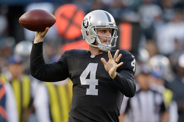 OAKLAND, CA - AUGUST 28: Quarterback Derek Carr #4 of the Oakland Raiders passes the ball against the Seattle Seahawks during a preseason game at O.co Coliseum on August 28, 2014 in Oakland, California.  (Photo by Ezra Shaw/Getty Images)
