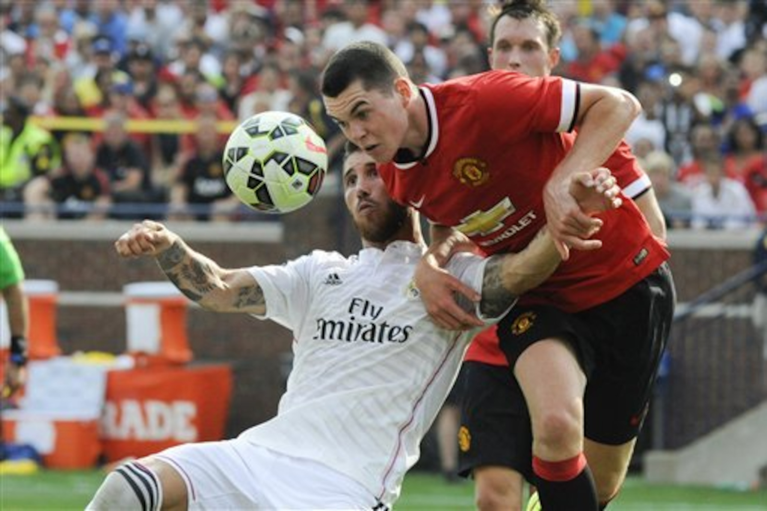 IMAGE DISTRIBUTED FOR GUINNESS INTERNATIONAL CHAMPIONS CUP - Real Madrid defender Sergio Ramos (4) and Manchester United defender Michael Keane (38) battle for the ball in the second half at Guinness International Champions Cup, on Saturday, August 2, 2014 in Ann Arbor, Michigan. (Jose Juarez/AP Images for Guinness International Champions Cup)
