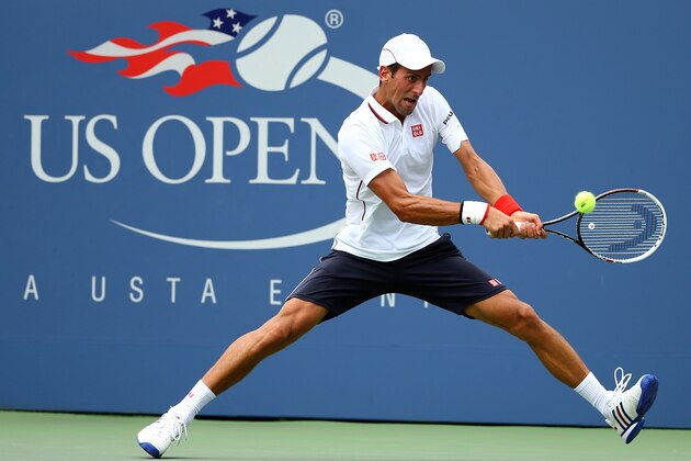 NEW YORK, NY - SEPTEMBER 01:  Novak Djokovic of Serbia returns a shot to Philipp Kohlschreiber of Germany during their men's singles fourth round match on Day Eight of the 2014 US Open at the USTA Billie Jean King National Tennis Center on September 1, 2014 in the Flushing neighborhood of the Queens borough of New York City.  (Photo by Al Bello/Getty Images)