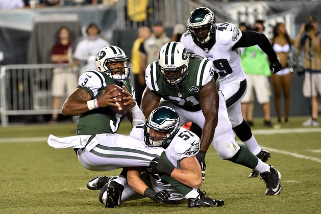 Aug 28, 2014; Philadelphia, PA, USA; Philadelphia Eagles outside linebacker Travis Long (57) sacks New York Jets quarterback Tajh Boyd (3) during the second half at Lincoln Financial Field. The Eagles won 37-7. Mandatory Credit: Derik Hamilton-USA TODAY Sports