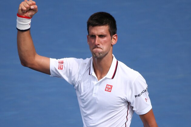 Novak Djokovic, of Serbia, reacts after a point against Philipp Kohlschreiber, of Germany, during the fourth round of the 2014 U.S. Open tennis tournament, Monday, Sept. 1, 2014, in New York. (AP Photo/John Minchillo)
