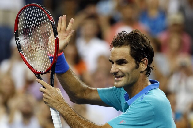 Roger Federer, of Switzerland, waves to the crowd after his victory against Marcel Granollers, of Spain, in the third round of the 2014 U.S. Open tennis tournament, Sunday, Aug. 31, 2014, in New York. Federer won 4-6, 6-1, 6-1, 6-1. (AP Photo/Elise Amendola)