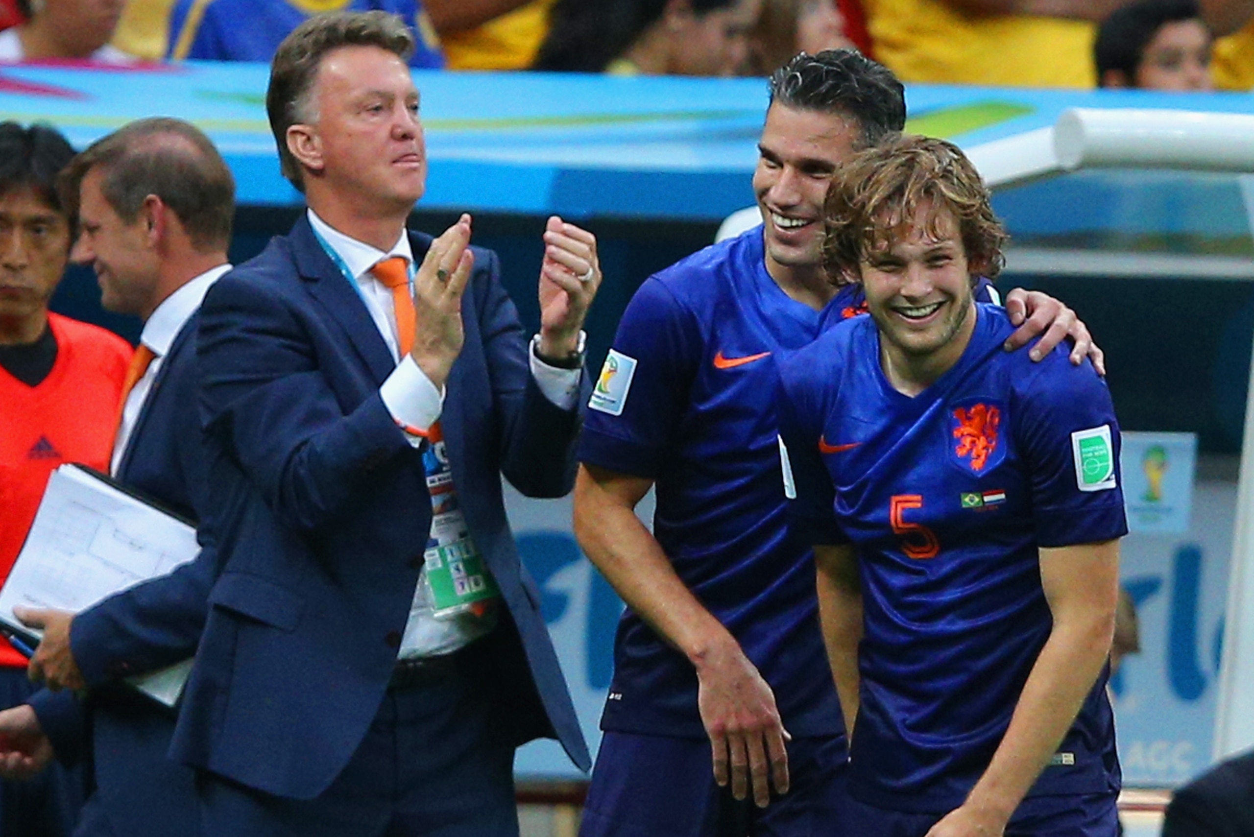 BRASILIA, BRAZIL - JULY 12: Daley Blind of the Netherlands (R) celebrates scoring his team's second goal with Robin van Persie and head coach Louis van Gaal during the 2014 FIFA World Cup Brazil Third Place Playoff match between Brazil and the Netherlands at Estadio Nacional on July 12, 2014 in Brasilia, Brazil.  (Photo by Dean Mouhtaropoulos/Getty Images)