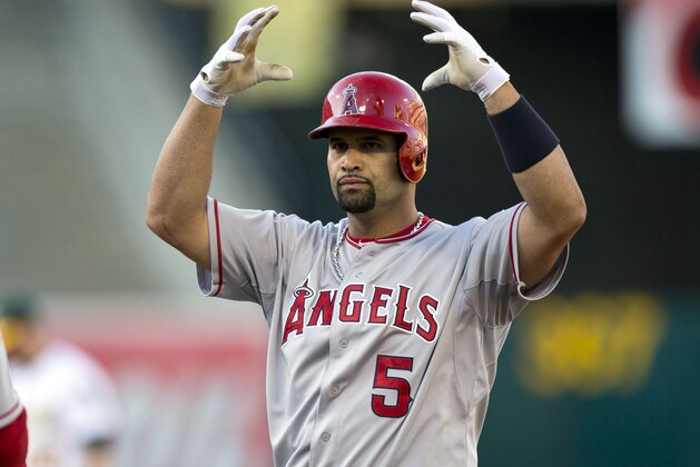 OAKLAND, CA - AUGUST 24:  Albert Pujols #5 of the Los Angeles Angels of Anaheim celebrates after hitting an RBI single against the Oakland Athletics during the fourth inning at O.co Coliseum on August 24, 2014 in Oakland, California. (Photo by Jason O. Watson/Getty Images)