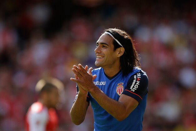 AS Monaco's Radamel Falcao applauds a teammate during the Emirates Cup soccer match between Arsenal and AS Monaco at Arsenal's Emirates Stadium, London, Sunday, Aug. 3, 2014.  (AP Photo/Matt Dunham)