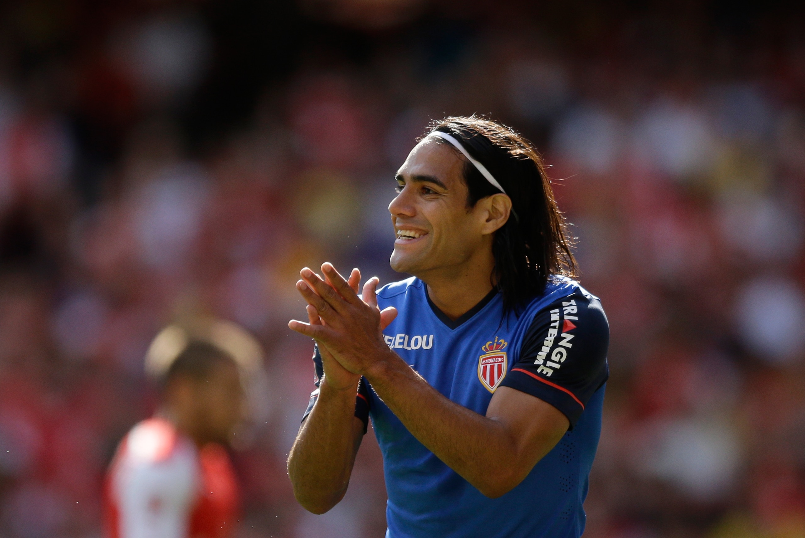 AS Monaco's Radamel Falcao applauds a teammate during the Emirates Cup soccer match between Arsenal and AS Monaco at Arsenal's Emirates Stadium, London, Sunday, Aug. 3, 2014.  (AP Photo/Matt Dunham)