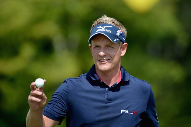 NORTON, MA - SEPTEMBER 01:  Luke Donald of England picks up his ball after making his putt on the 13th hole during the final round of the Deutsche Bank Championship at the TPC Boston on September 1, 2014 in Norton, Massachusetts.  (Photo by Ross Kinnaird/Getty Images)