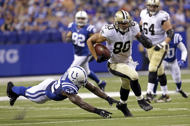 New Orleans Saints tight end Jimmy Graham (80) out runs the tackle of Indianapolis Colts inside linebacker D'Qwell Jackson during the first half of an NFL preseason football game in Indianapolis, Saturday, Aug. 23, 2014. (AP Photo/AJ Mast)