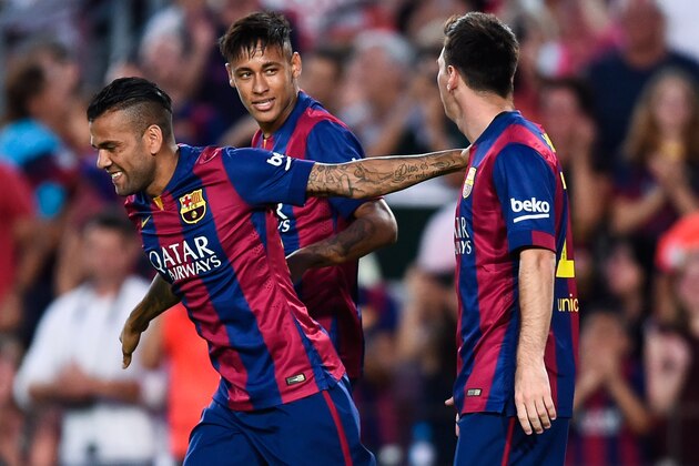 BARCELONA, SPAIN - AUGUST 18:  Lionel Messi of FC Barcelona celebrates with his teammates Neymar (L) and Dani Alves after scoring the opening goalduring the Joan Gamper Trophy match between FC Barcelona and Club Leon at Camp Nou on August 18, 2014 in Barcelona, Spain.  (Photo by David Ramos/Getty Images)