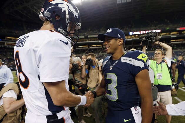 ADVANCE FOR WEEKEND EDITIONS, JAN. 25-26 - FILE - In this Aug. 17, 2013, file photo, Seattle Seahawks quarterback Russell Wilson (3) shakes hands with Denver Broncos quarterback Peyton Manning, left, after the Seahawks beat the Broncos 40-10 in preseason NFL football game  in Seattle. The two teams are slated to meet in Super Bowl XLVIII on Sunday, Feb. 2, 2014, in East Rutherford, N.J. (AP Photo/John Froschauer, File)