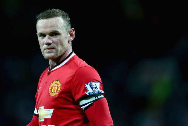 MANCHESTER, ENGLAND - AUGUST 12:  Wayne Rooney of Manchester United in action during the Pre Season Friendly match between Manchester United and Valencia at Old Trafford on August 12, 2014 in Manchester, England.  (Photo by Clive Brunskill/Getty Images)