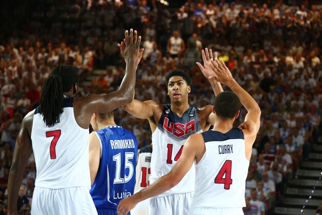 BILBAO, SPAIN - AUGUST 30:  Teammates Kenneth Faried #7, Anthony Davis #14, and Stephen Curry #4 of the USA Basketball Men's National Team high-five during a game against the Finland Basketball Men's National Team during the 2014 FIBA World Cup at Bizkaia Arena in Bilbao Exhibition Centre on August 30, 2014 in Bilbao, Spain.  NOTE TO USER: User expressly acknowledges and agrees that, by downloading and/or using this Photograph, user is consenting to the terms and conditions of the Getty Images License Agreement. Mandatory Copyright Notice: Copyright 2014 NBAE (Photo by Nathaniel S. Butler/NBAE via Getty Images)