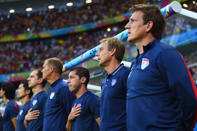 SALVADOR, BRAZIL - JULY 01:  Head coach Jurgen Klinsmann of the United States (2nd R) sings the National Anthem prior to the 2014 FIFA World Cup Brazil Round of 16 match between Belgium and the United States at Arena Fonte Nova on July 1, 2014 in Salvador, Brazil.  (Photo by Laurence Griffiths/Getty Images)