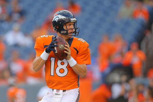 DENVER, CO - AUGUST 23:  Quarterback Peyton Manning #18 of the Denver Broncos throws as he warms up before a preseason game at Sports Authority Field at Mile High on August 23, 2014 in Denver, Colorado.  (Photo by Justin Edmonds/Getty Images)