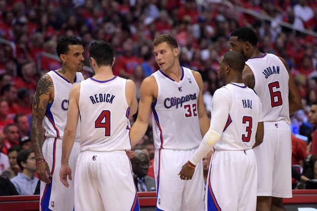 Los Angeles Clippers, from left, Matt Barnes, J.J. Redick, Blake Griffin, Chris Paul and DeAndre Jordan  talk in the second half of Game 6 of the Western Conference semifinal NBA basketball playoff series against the Oklahoma City Thunder, Thursday, May 15, 2014, in Los Angeles. (AP Photo/Mark J. Terrill)