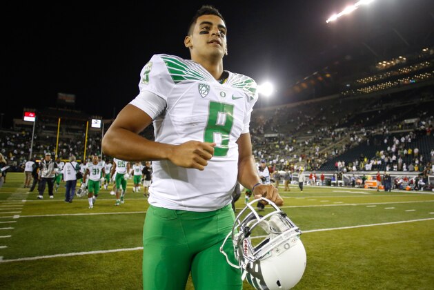 EUGENE, OR - AUGUST 30:  Quarterback Marcus Mariota #8 of the Oregon Ducks heads off the field after defeating the South Dakota Coyotes 62-13 at Autzen Stadium on August 30, 2014 in Eugene, Oregon.  (Photo by Otto Greule Jr/Getty Images)