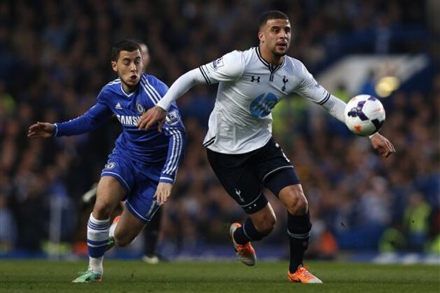 Chelsea's Eden Hazard, left, competes with Tottenham Hotspur's Kyle Walker during their English Premier League soccer match at Stamford Bridge, London, Saturday, March 8, 2014. (AP Photo/Sang Tan)