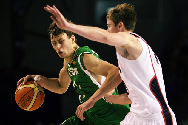 AUCKLAND, NEW ZEALAND - JULY 08:  Donatas Motiejunas of Lithuania tries to get past Gordon Hayward of the United States defends during the U19 Basketball World Championships match between the United States and Lithuania at North Shore Events Centre on July 8, 2009 in Auckland, New Zealand.  (Photo by Hannah Peters/Getty Images)