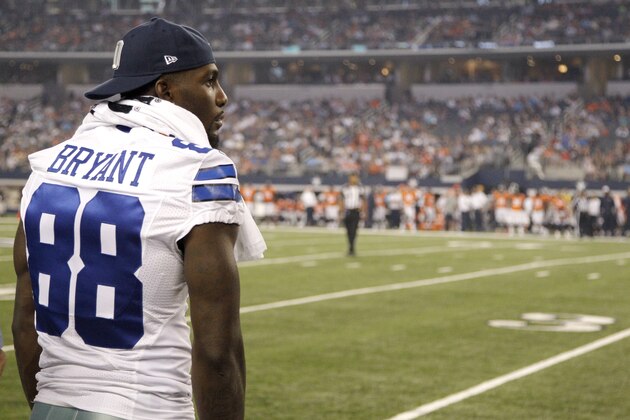 Dallas Cowboys wide receiver Dez Bryant watches from the sidelines in the first half of a NFL preseason football game against the Denver Broncos, Thursday, Aug. 28. 2014, in Arlington, Texas. (AP Photo/Brandon Wade)