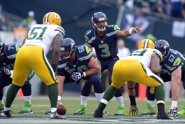 Sep 24, 2012; Seattle, WA, USA; Seattle Seahawks quarterback Russell Wilson (3) takes the snap from center Max Unger (60) against the Green Bay Packers at CenturyLink Field. Mandatory Credit: Kirby Lee/Image of Sport-USA TODAY Sports