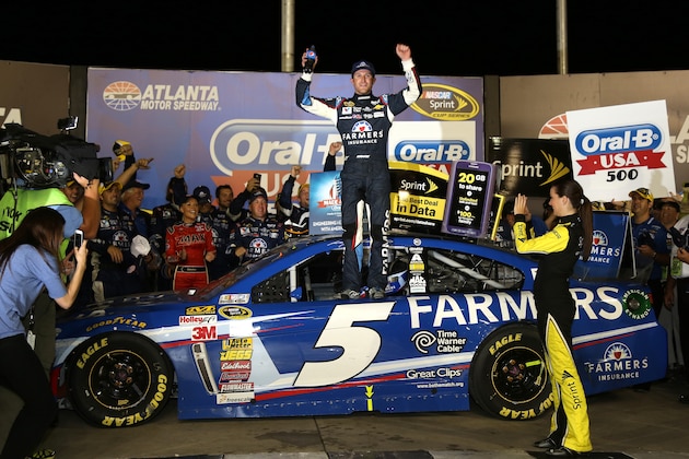 HAMPTON, GA - AUGUST 31:  Kasey Kahne, driver of the #5 Farmers Insurance Chevrolet, celebrates in Victory Lane after winning the NASCAR Sprint Cup Series Oral-B USA 500 at Atlanta Motor Speedway on August 31, 2014 in Hampton, Georgia.  (Photo by Jerry Markland/Getty Images)