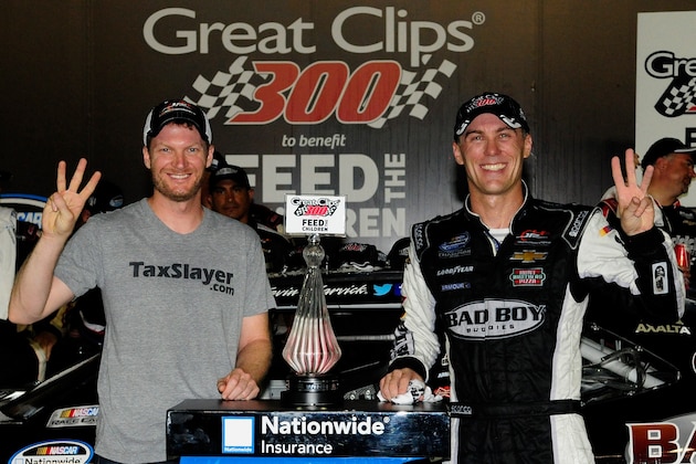 HAMPTON, GA - AUGUST 30:  Kevin Harvick, driver of the #5 Bad Boy Buggies Chevrolet, and Dale Earnhardt Jr., owner of Jr. Motorsports, pose with the trophy in Victory Lane after winning the NASCAR Nationwide Series Great Clips 300 at Atlanta Motor Speedway on August 30, 2014 in Hampton, Georgia.  (Photo by Jeff Curry/Getty Images)